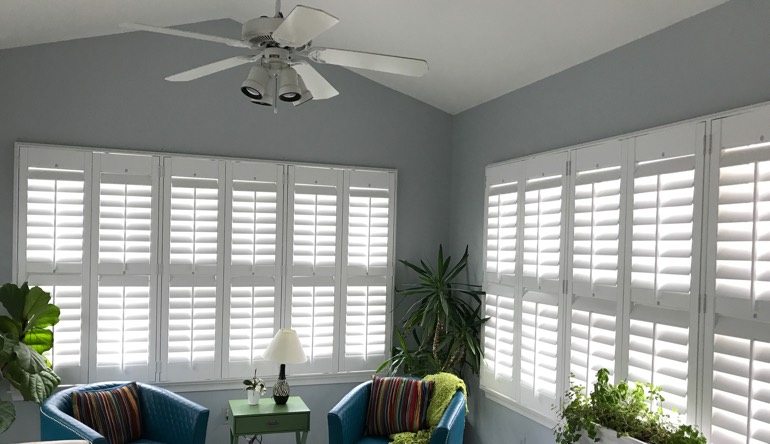 Charlotte sunroom with fan and shutters